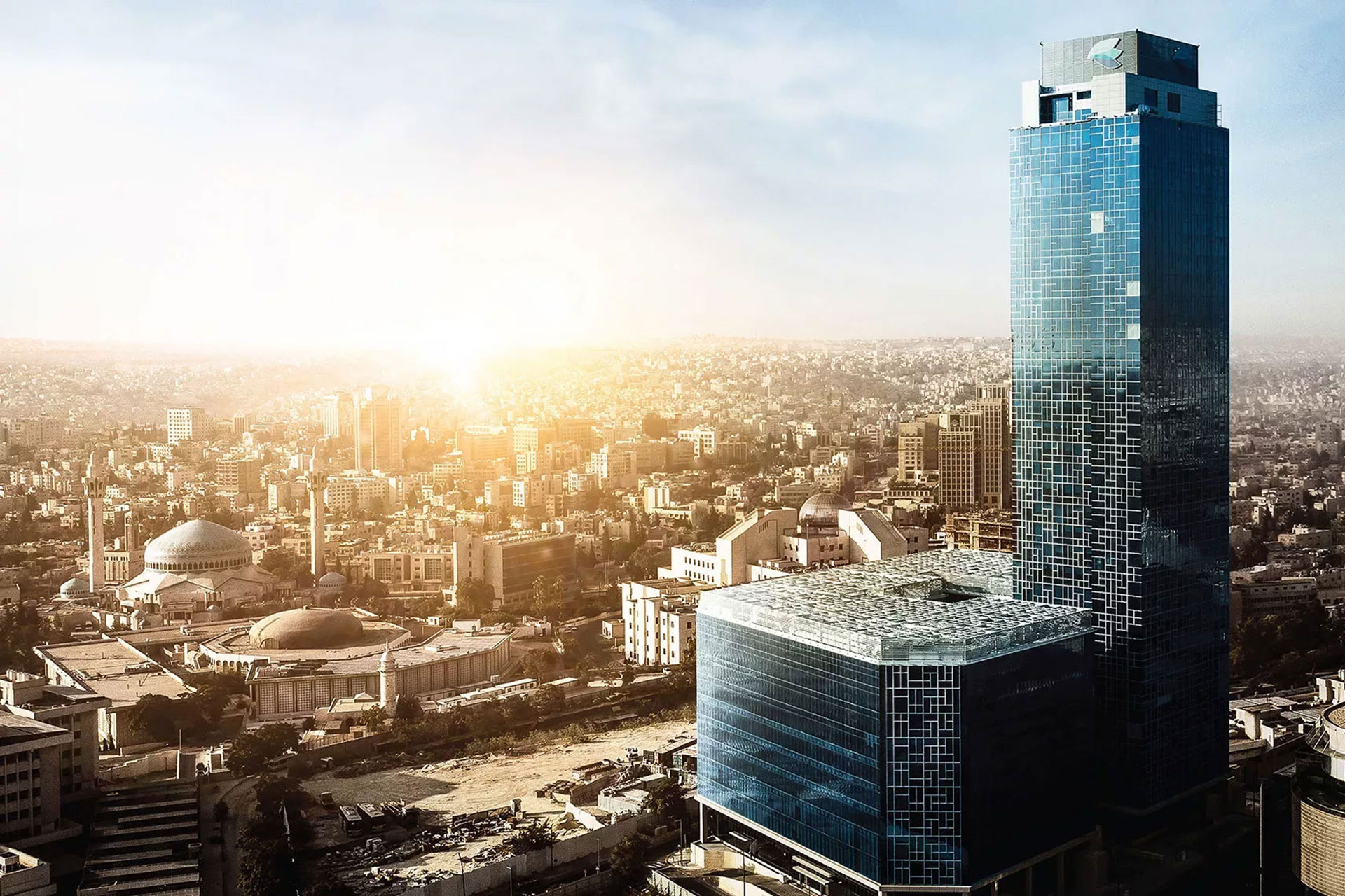 Amman city skyline with Abdali Boulevard tower at sunset.