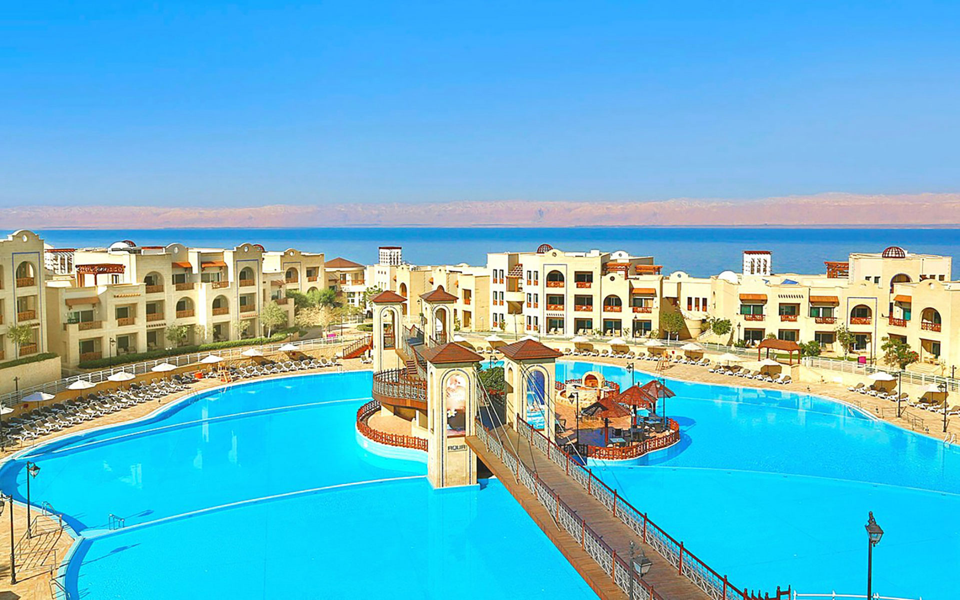 Luxury resort with large swimming pool and Dead Sea view in Jordan.