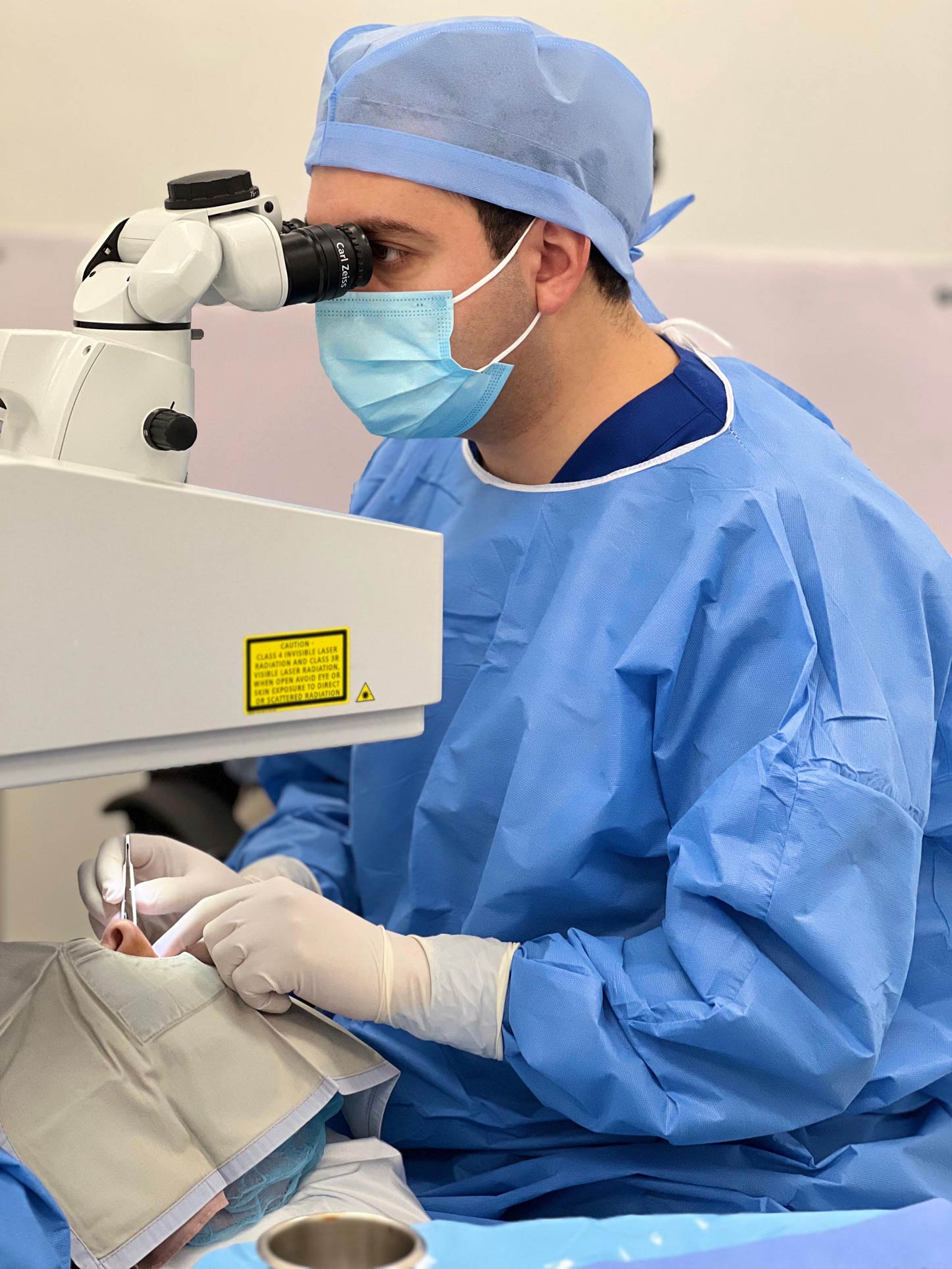 Ophthalmic surgeon performing laser eye surgery using an excimer laser machine in Jordan.